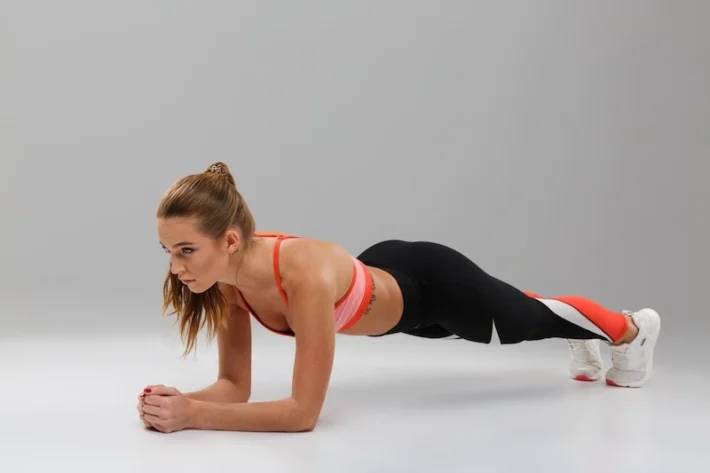 Clinical Pilates plank exercise with a fit sportsgirl at Morley Physiotherapy
